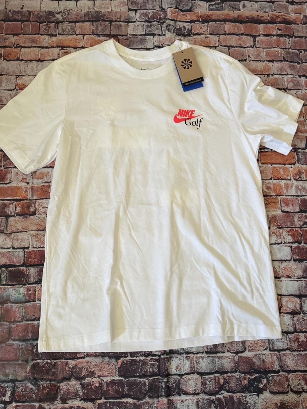 Nike White Short-Sleeve Golf Logo Tee with Red Swoosh